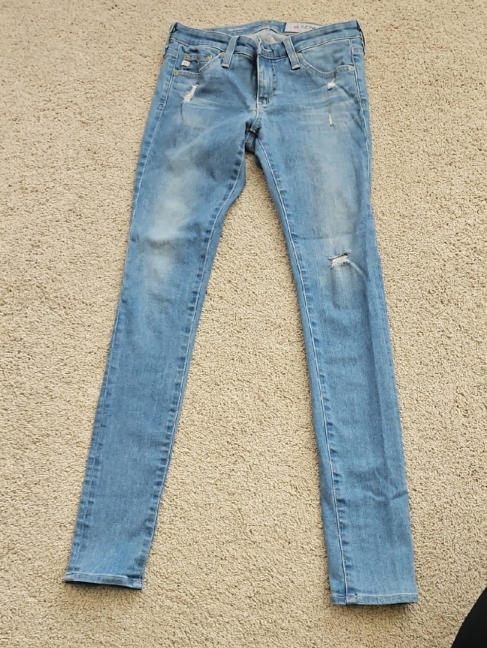 AG Adriano Goldschmied Light Blue Skinny Jeans with Distressed Details